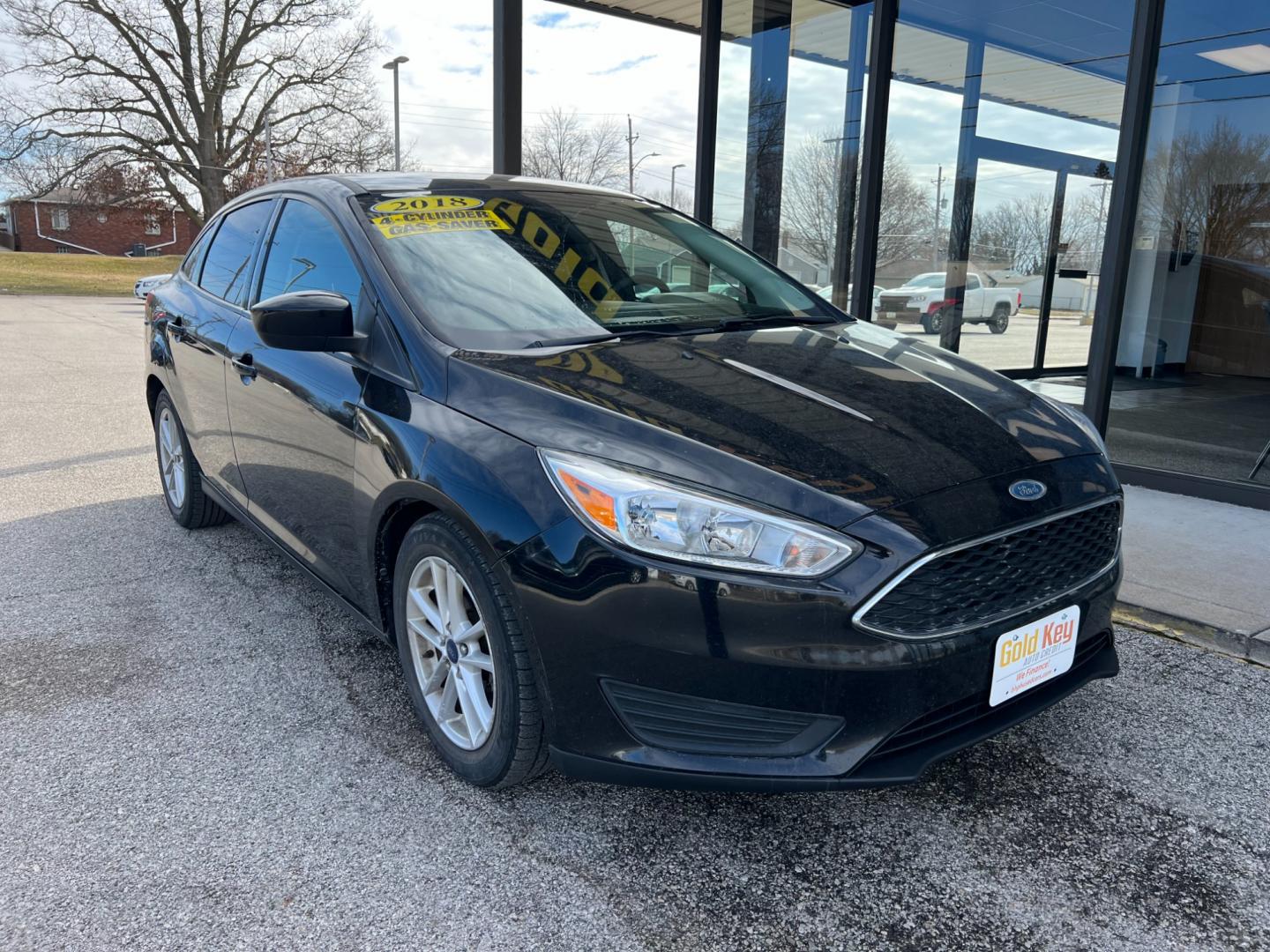 2018 Shadow Black Ford Focus SE Sedan (1FADP3FE7JL) with an 1.0L L3 engine, located at 1633 W Kimberly, Davenport, IA, 52806, (563) 323-5341, 41.559456, -90.598732 - Photo#1